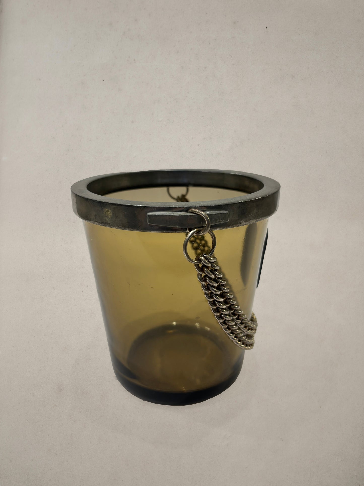Amber glass ice bucket with pewter medallion and chain, England, 1950s
