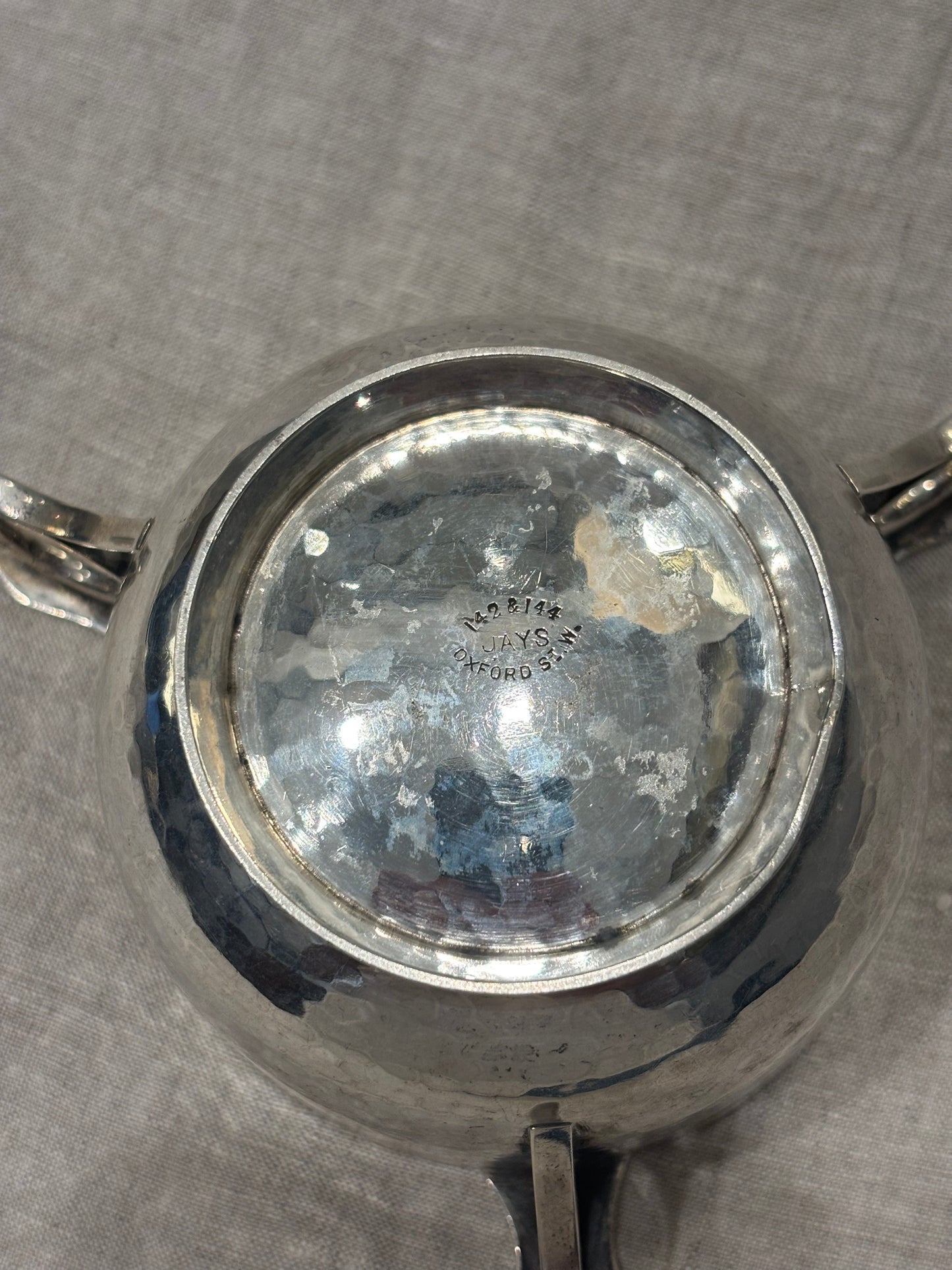Hammered silver bowl with double handles and engraved name "Mary Langley", Arts and Crafts period, bottom