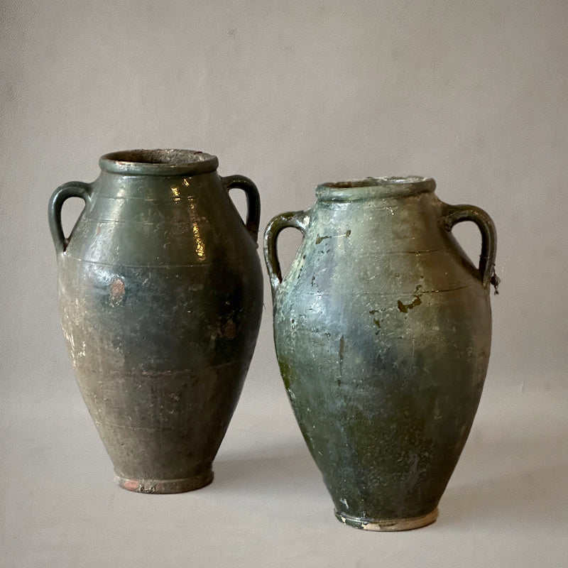 Pair of green-glazed Spanish amphora vases with loop handles, 19th-century earthenware, circa 1870, side
