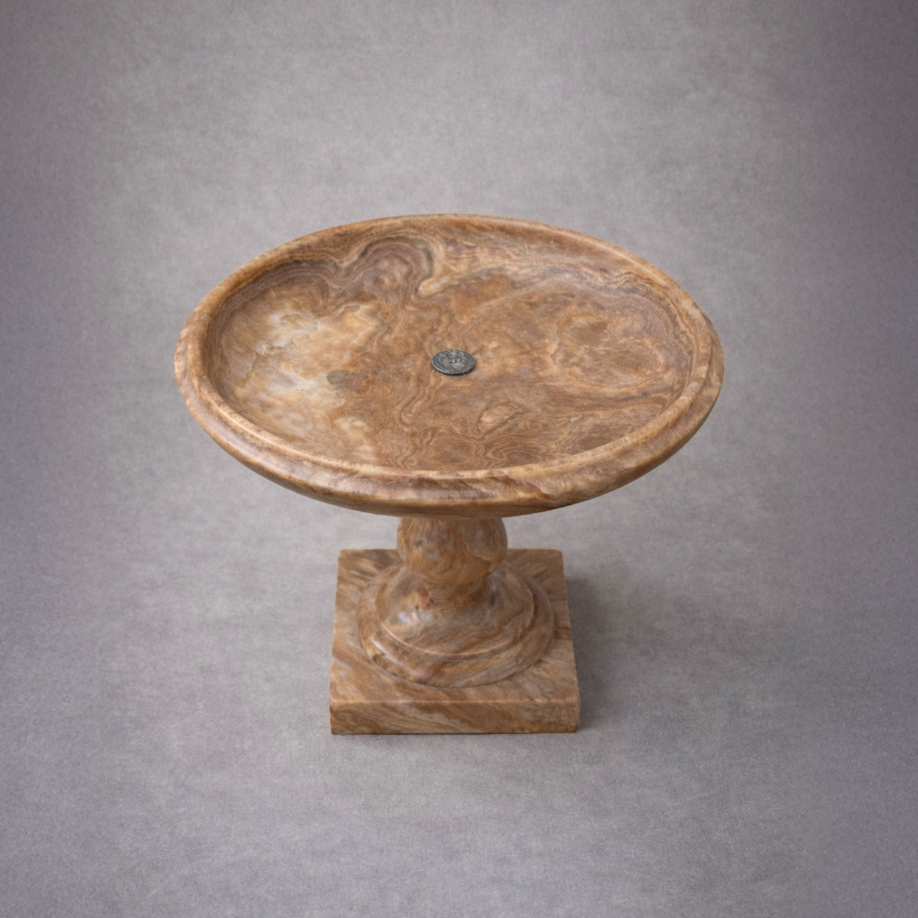 Italian carved onyx tazza with baluster stem and square base, circa 1900, featuring warm honey and caramel stone veining top view