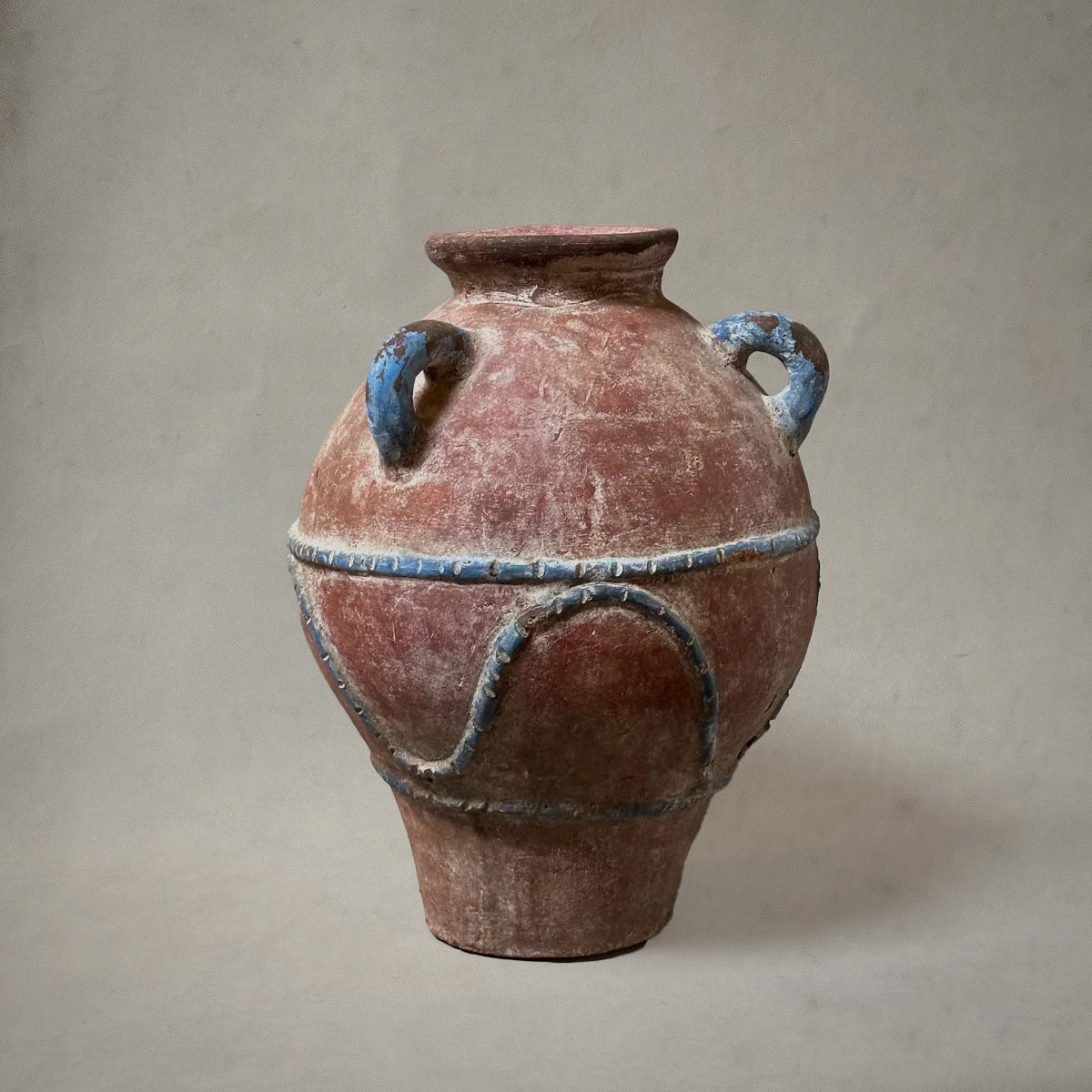 Mexican hand-painted terra-cotta vessel with blue detailing and three loop handles, 1980