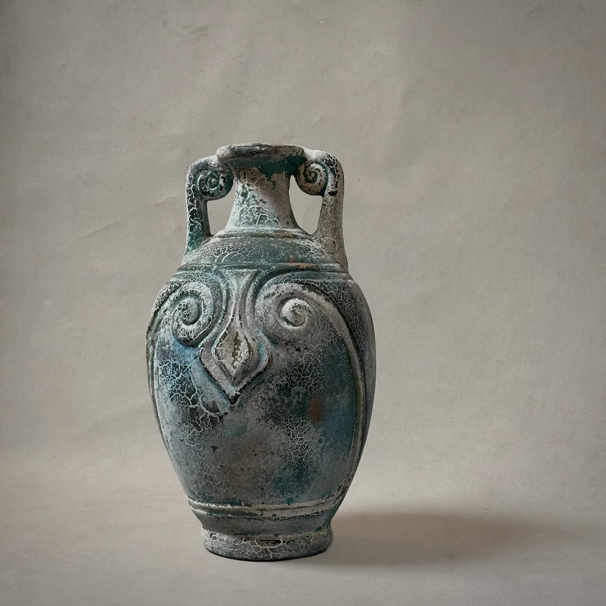 Mexican terracotta vessel with spiral handles and aged verdigris patina, circa 1980