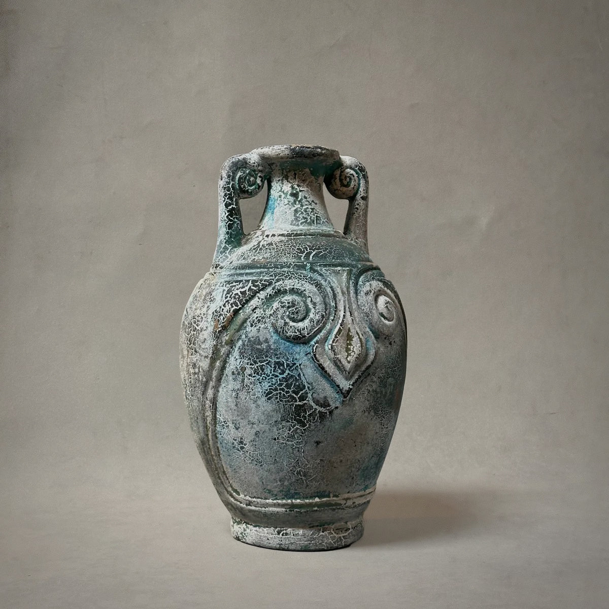 Mexican terracotta vessel with spiral handles and aged verdigris patina, circa 1980