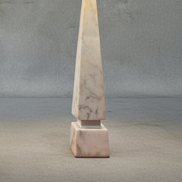 Bottom detail of midcentury Italian white Carrara marble table lamps with geometric bases and ivory linen shades on a neutral textured backdrop