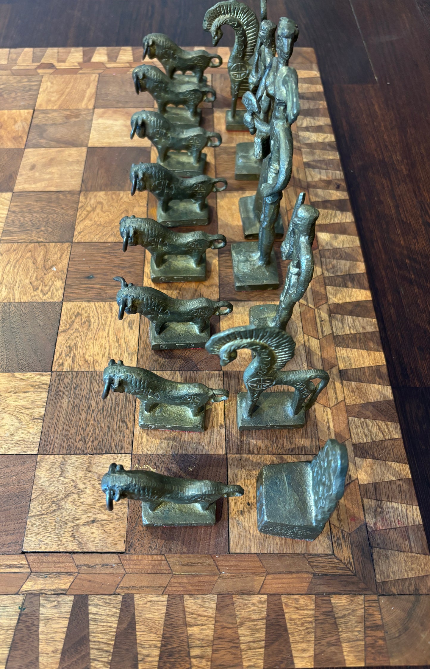 Bronze Minoan chess set by Christoforus Sklavenitis paired with antique English inlaid wood chessboard, side detail