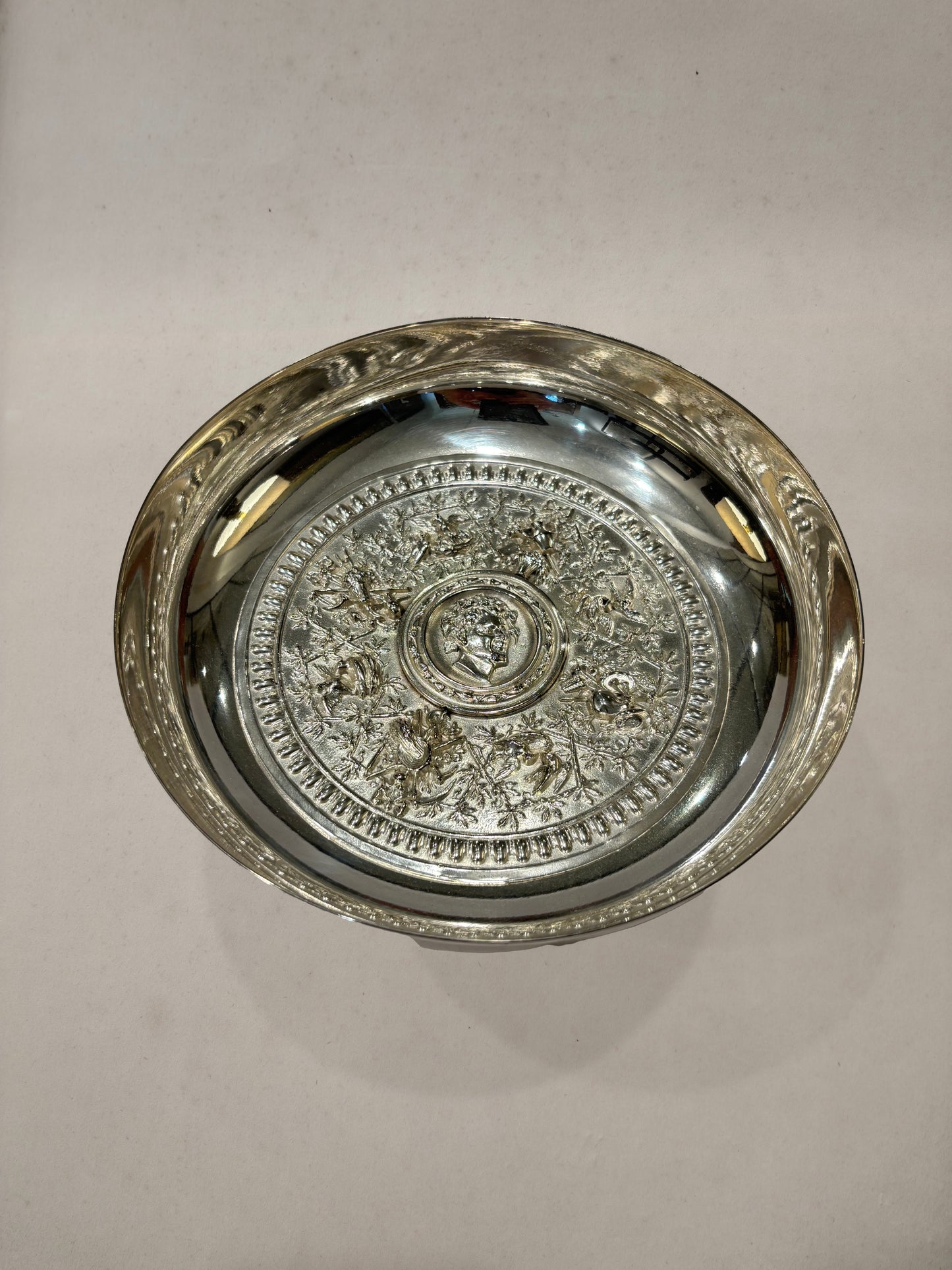 Silverplate footed bowl with embossed medallion and floral motifs, England circa 1900