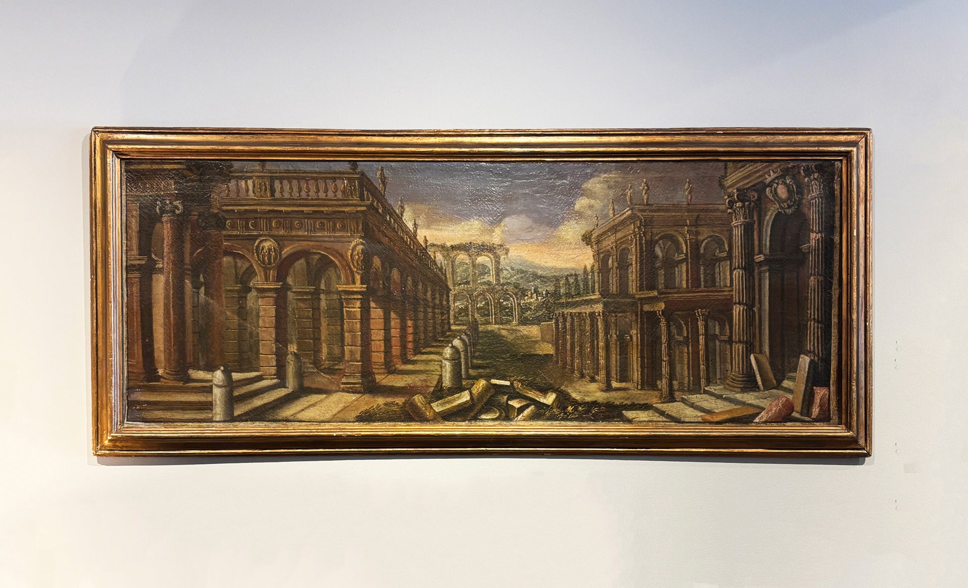 18th-century Italian capriccio oil painting with classical Roman ruins in a gilt wood frame
