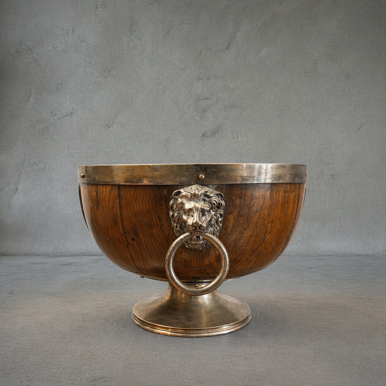 19th century English oak and silver plate wine cooler with lion mask ring handles, engraved September 1892 cartouche, coopered wood body, pedestal base