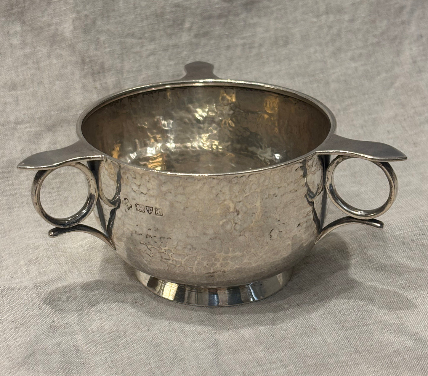 Hammered silver bowl with double handles and engraved name "Mary Langley", Arts and Crafts period, top view