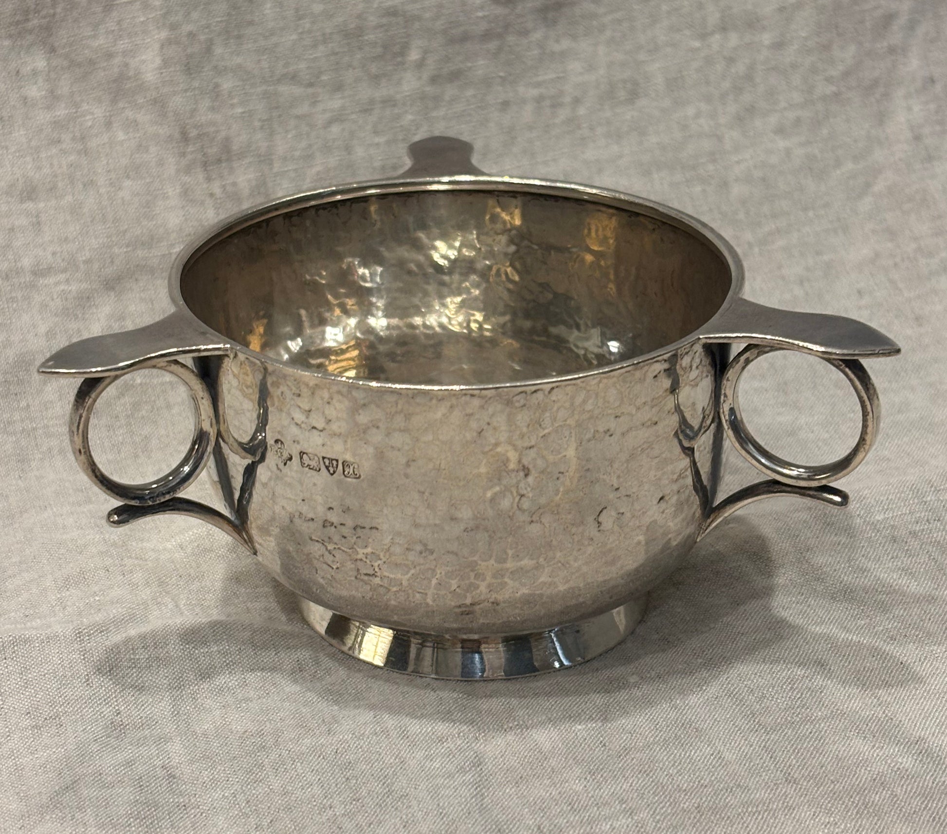 Hammered silver bowl with double handles and engraved name "Mary Langley", Arts and Crafts period, top view