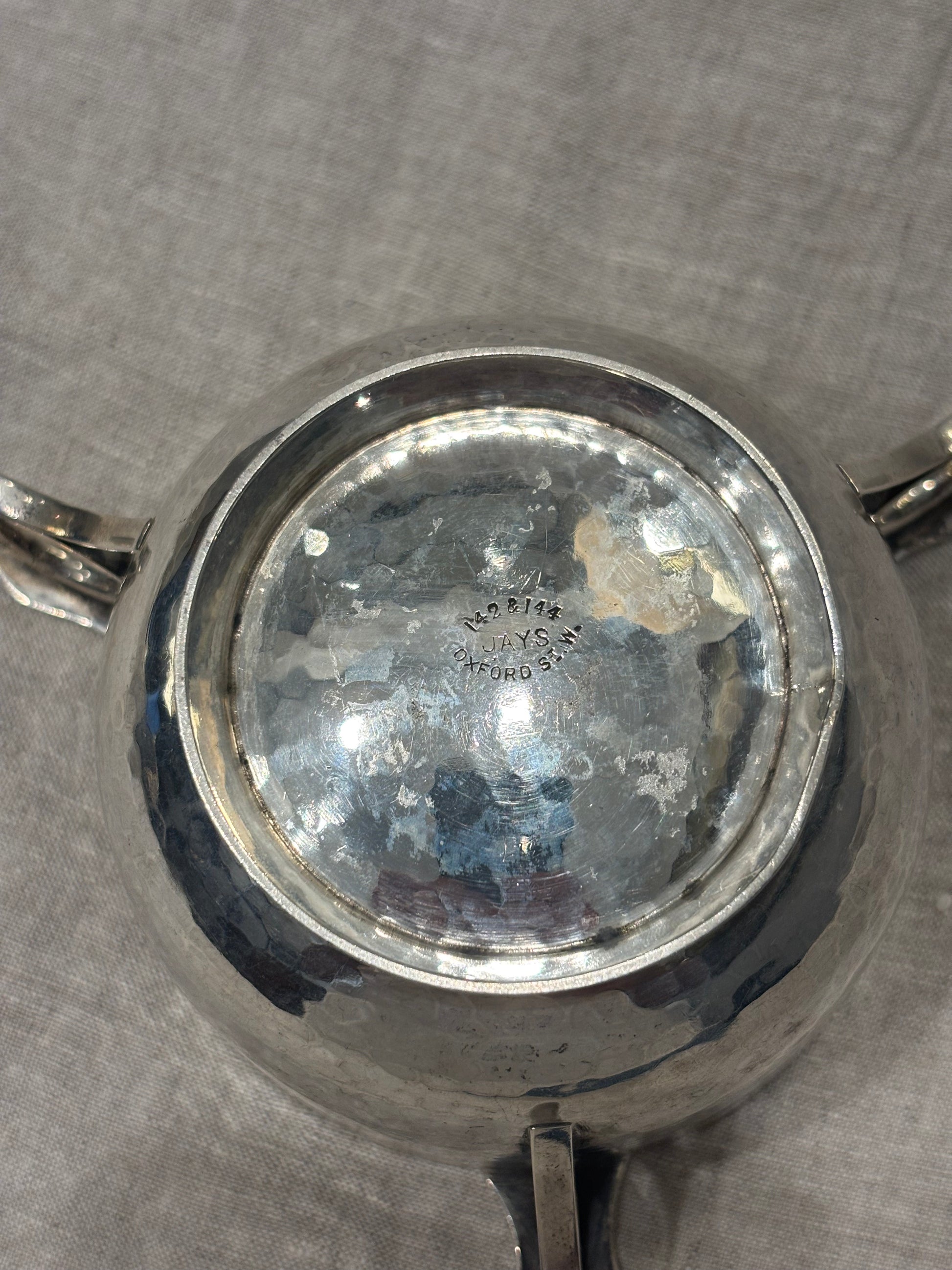 Hammered silver bowl with double handles and engraved name "Mary Langley", Arts and Crafts period, bottom