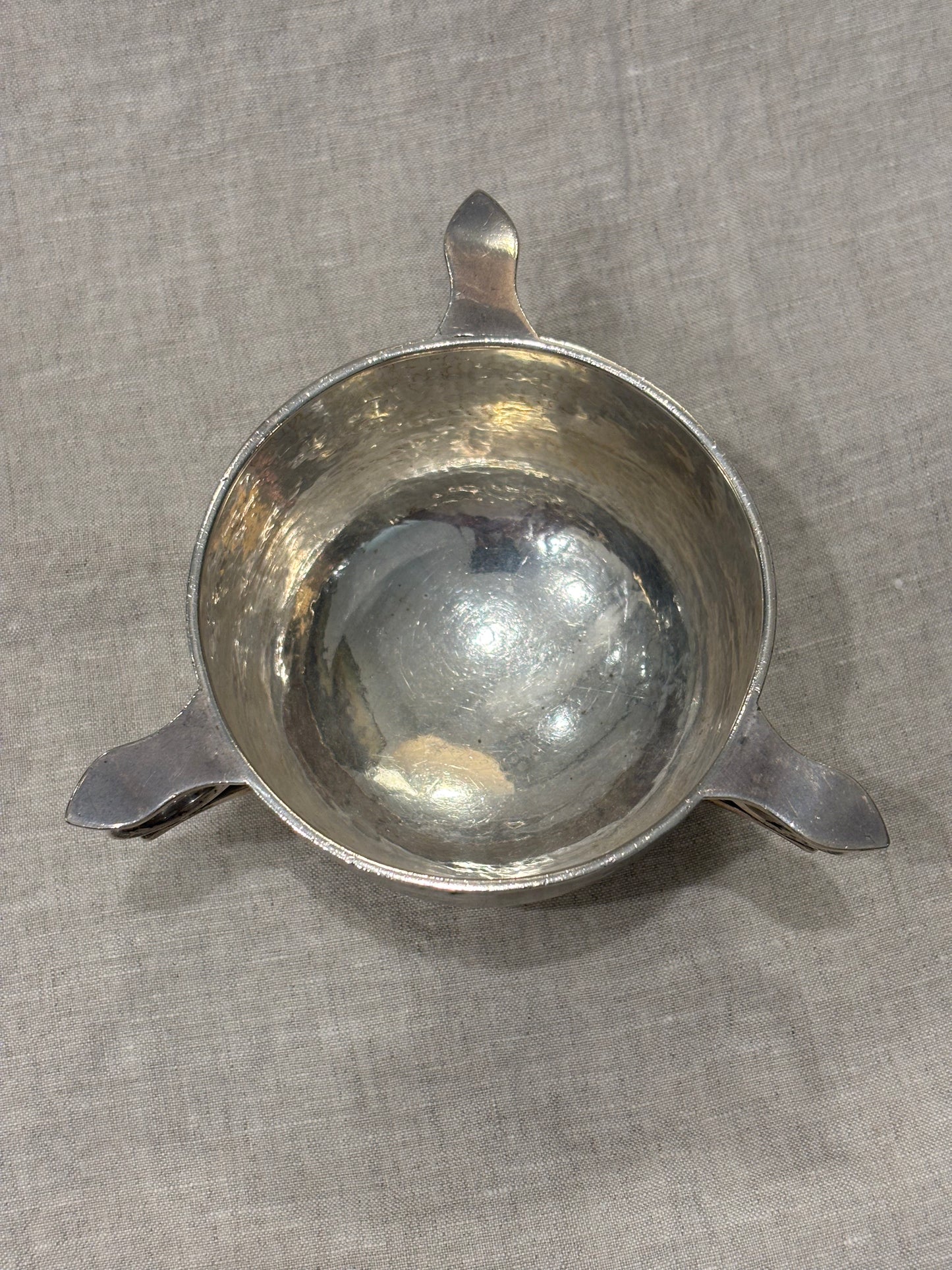 Hammered silver bowl with double handles and engraved name "Mary Langley", Arts and Crafts period, top