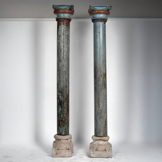 Pair of antique French painted architectural columns with aged aquamarine finish and stone bases