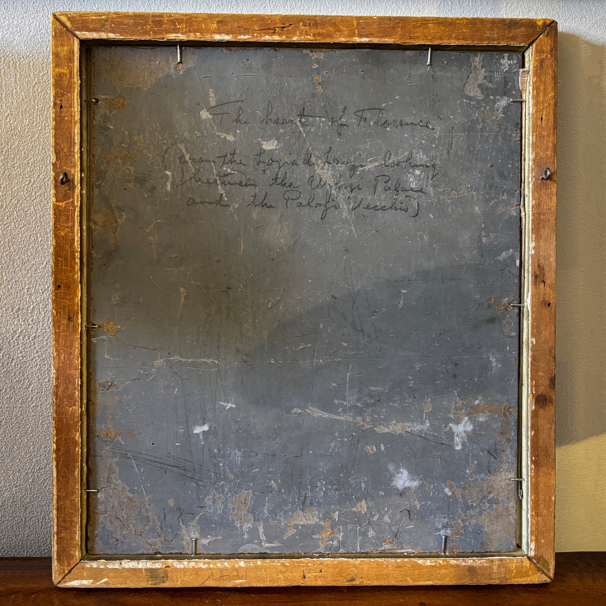 Reverse of Florence cityscape painting with handwritten inscription describing the view from the Loggia dei Lanzi toward the Uffizi and Palazzo Vecchio.