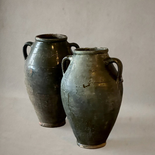 Pair of green-glazed Spanish amphora vases with loop handles, 19th-century earthenware, circa 1870