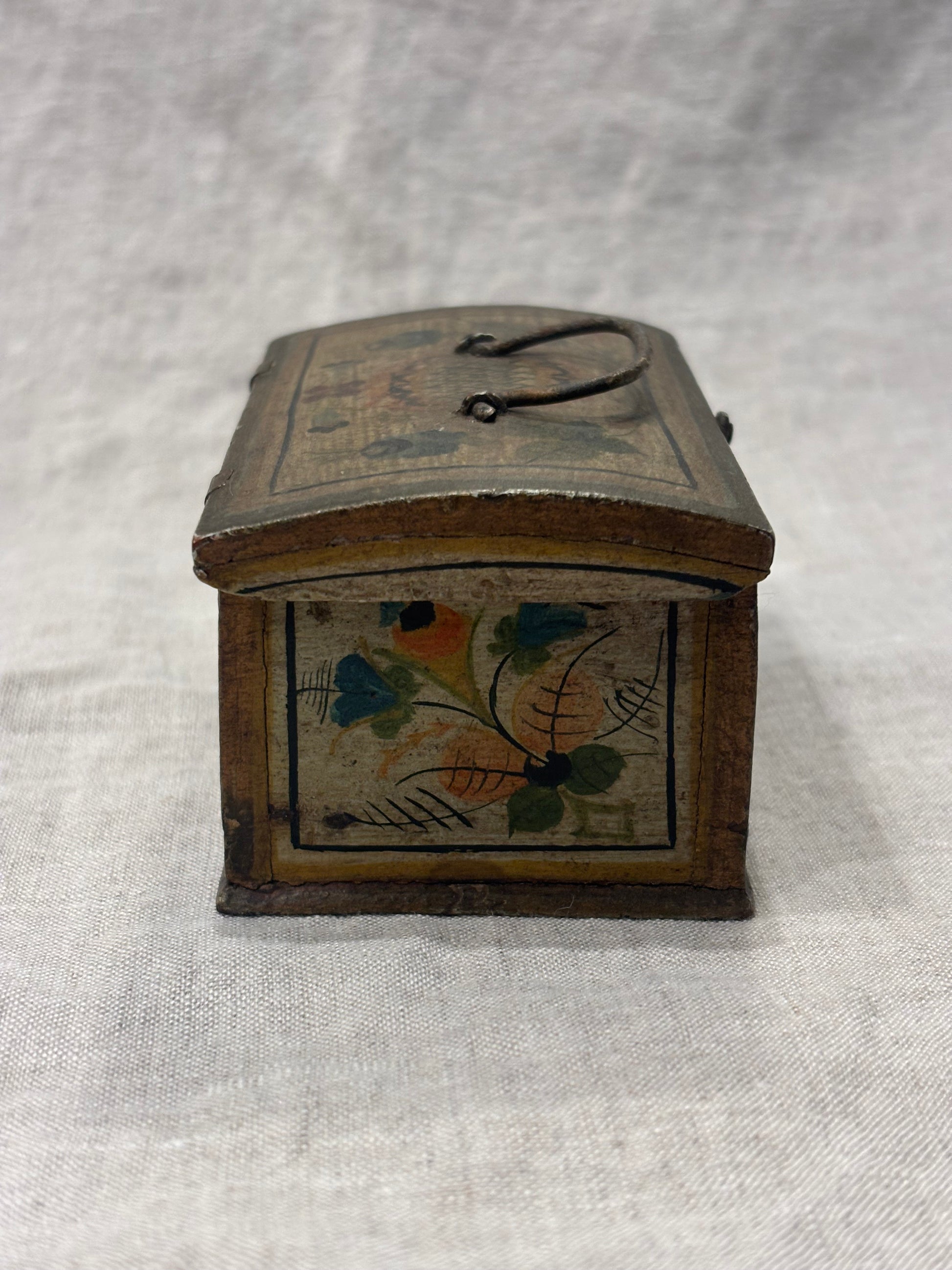 Antique hand-painted miniature chest with floral folk art design, circa 1880, left