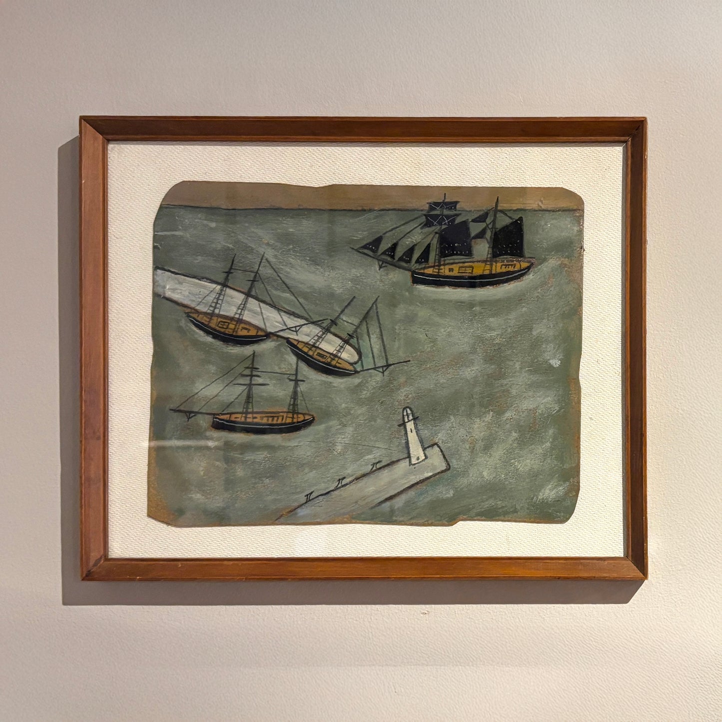 Maritime folk-style painting by Max Wildman showing four boats and a breakwater, framed in wood