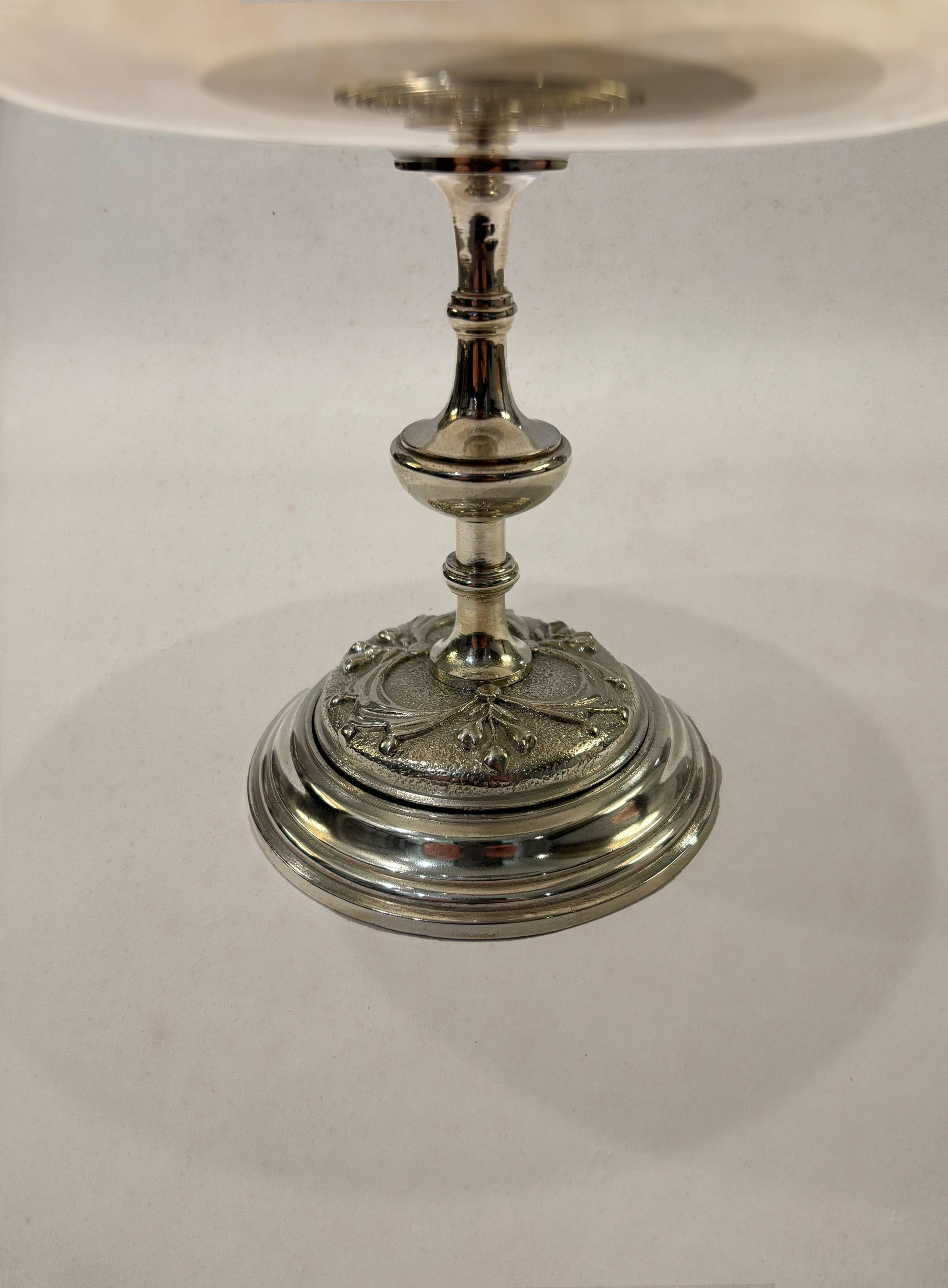 Silverplate footed bowl with embossed medallion and floral motifs, England circa 1900